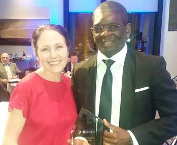 Tamuka Nyawo after receiving his award from the GRCI Managing Director Naomi Burley.